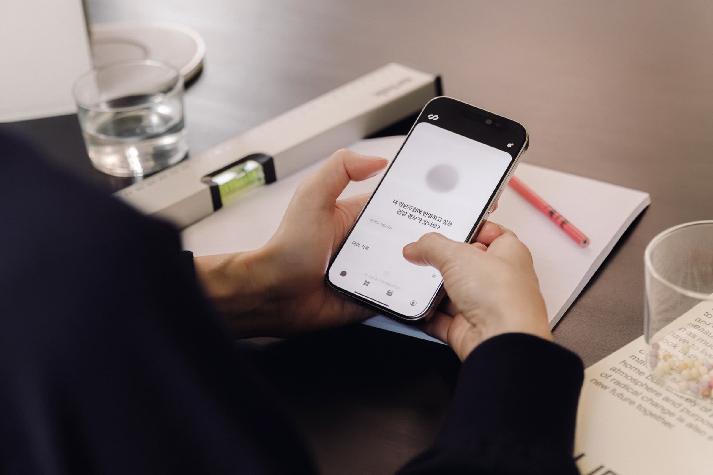 User entering health information on a phone to set up a personalized plan for the E1.